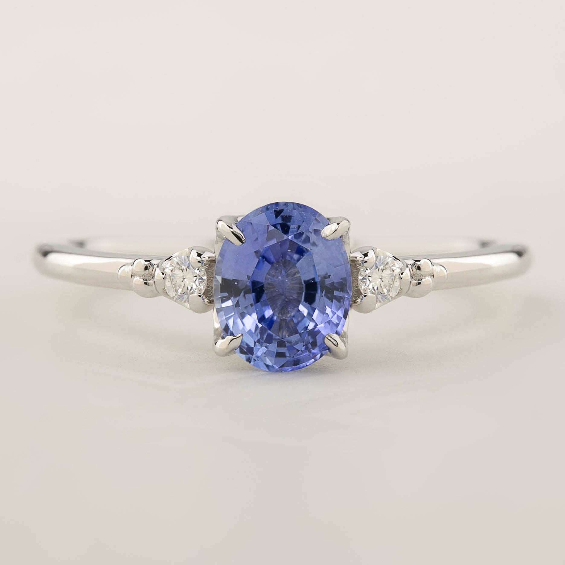 One of a kind Estel ring with 1ct Blue Ceylon Sapphire and white accent diamonds in 14k white gold band
