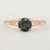 Estel Luxe Ring featuring a 0.97ct peacock green Montana sapphire and white diamond accents in rose gold band.