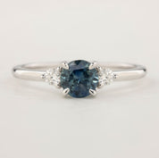 Emilie Ring with 0.85ct blue Montana sapphire and accent diamonds, handmade in recycled 14k white gold, one of a kind