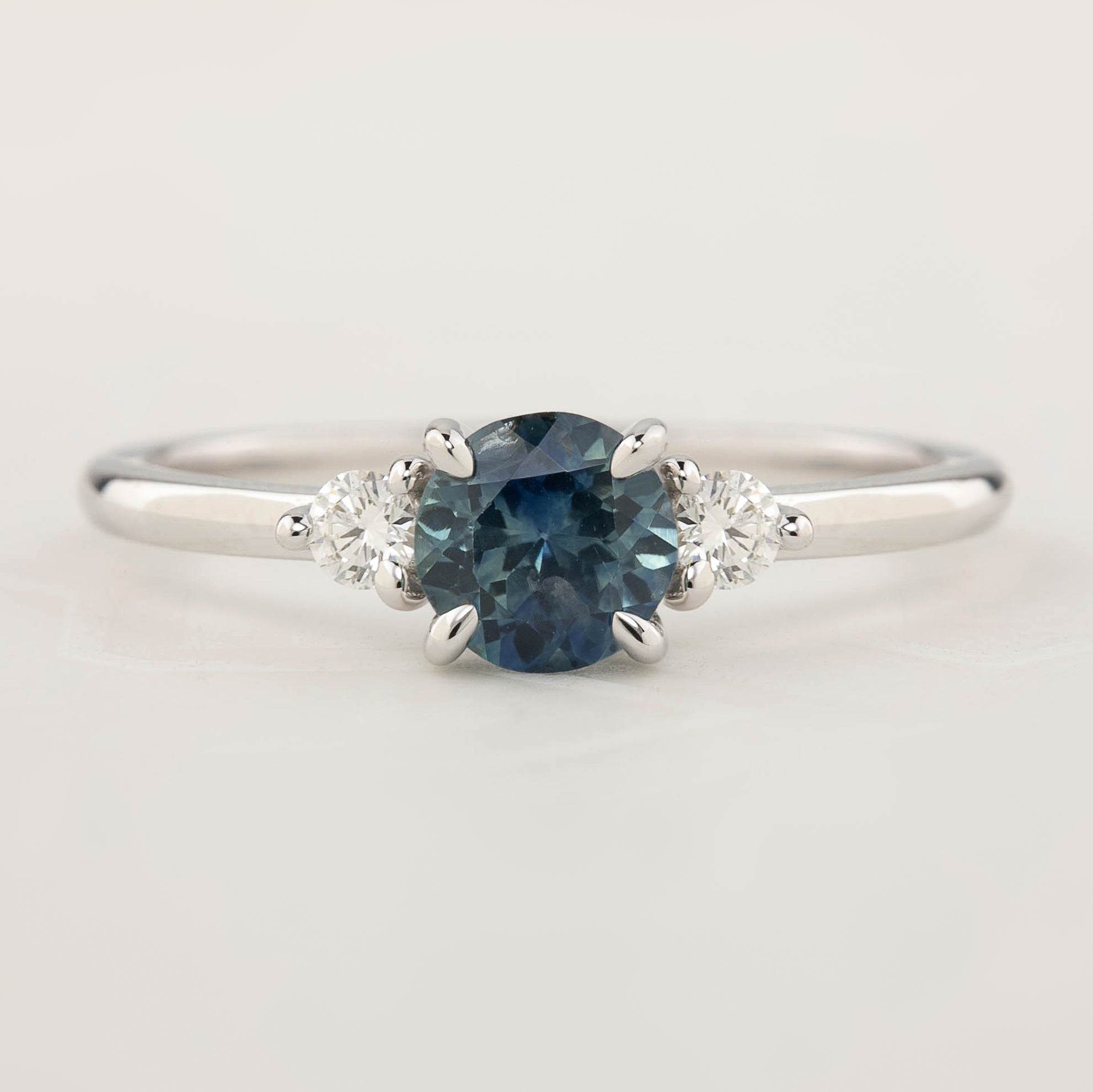 Emilie Ring with 0.85ct blue Montana sapphire and accent diamonds, handmade in recycled 14k white gold, one of a kind