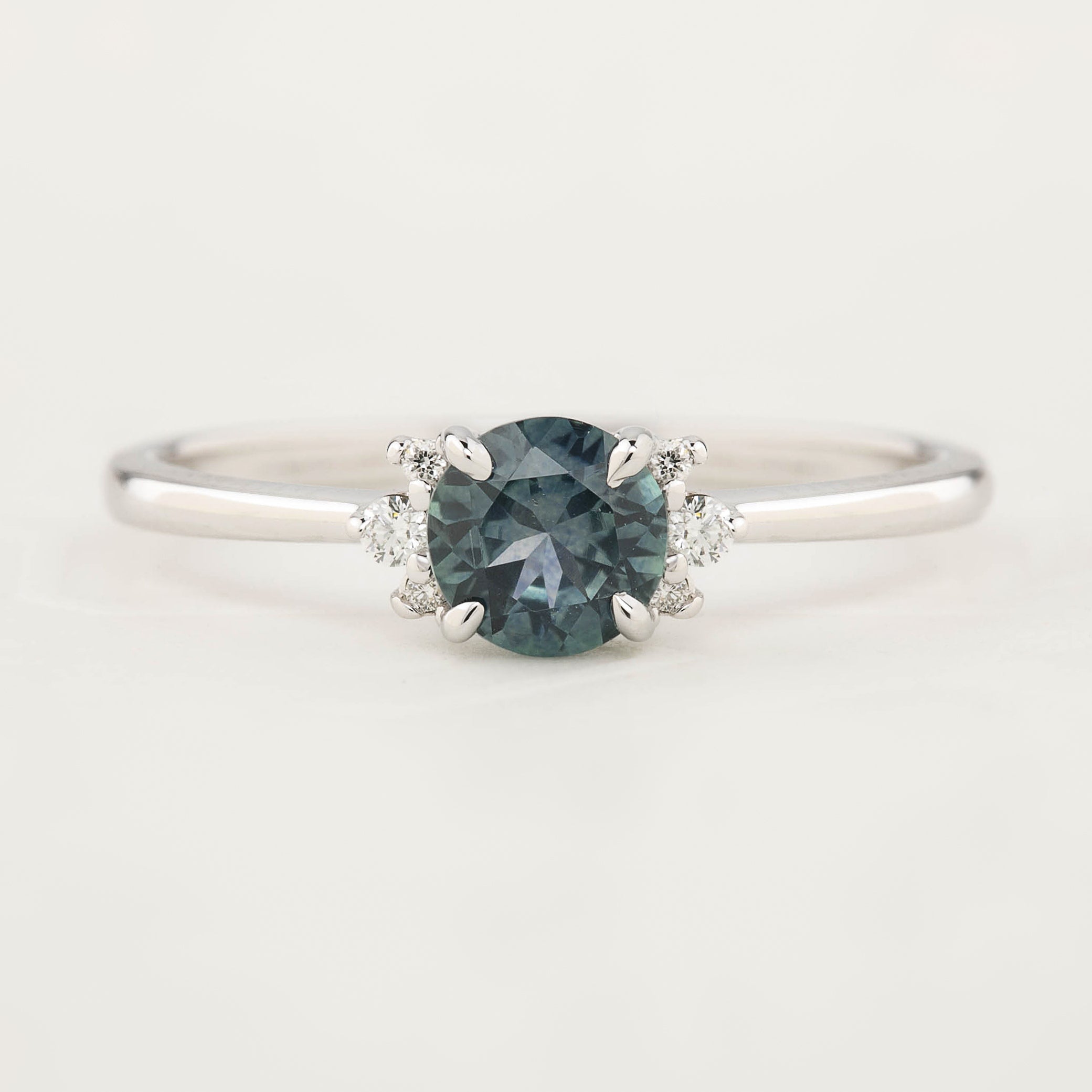 St, check out the Lena Ring, a unique piece with a 0.65ct blue-green Montana Sapphire set in shimmering 14k white gold!