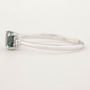 Stunning Lena Ring featuring a 0.65ct blue-green Montana Sapphire, set in 14k white gold with sparkling accent diamonds.