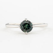 Alice Ring, 0.85ct Queensland Sapphire ring with a green gemstone on a white background