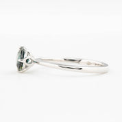 Alice Ring, 0.85ct Queensland Sapphire ring with a green gemstone on a white background