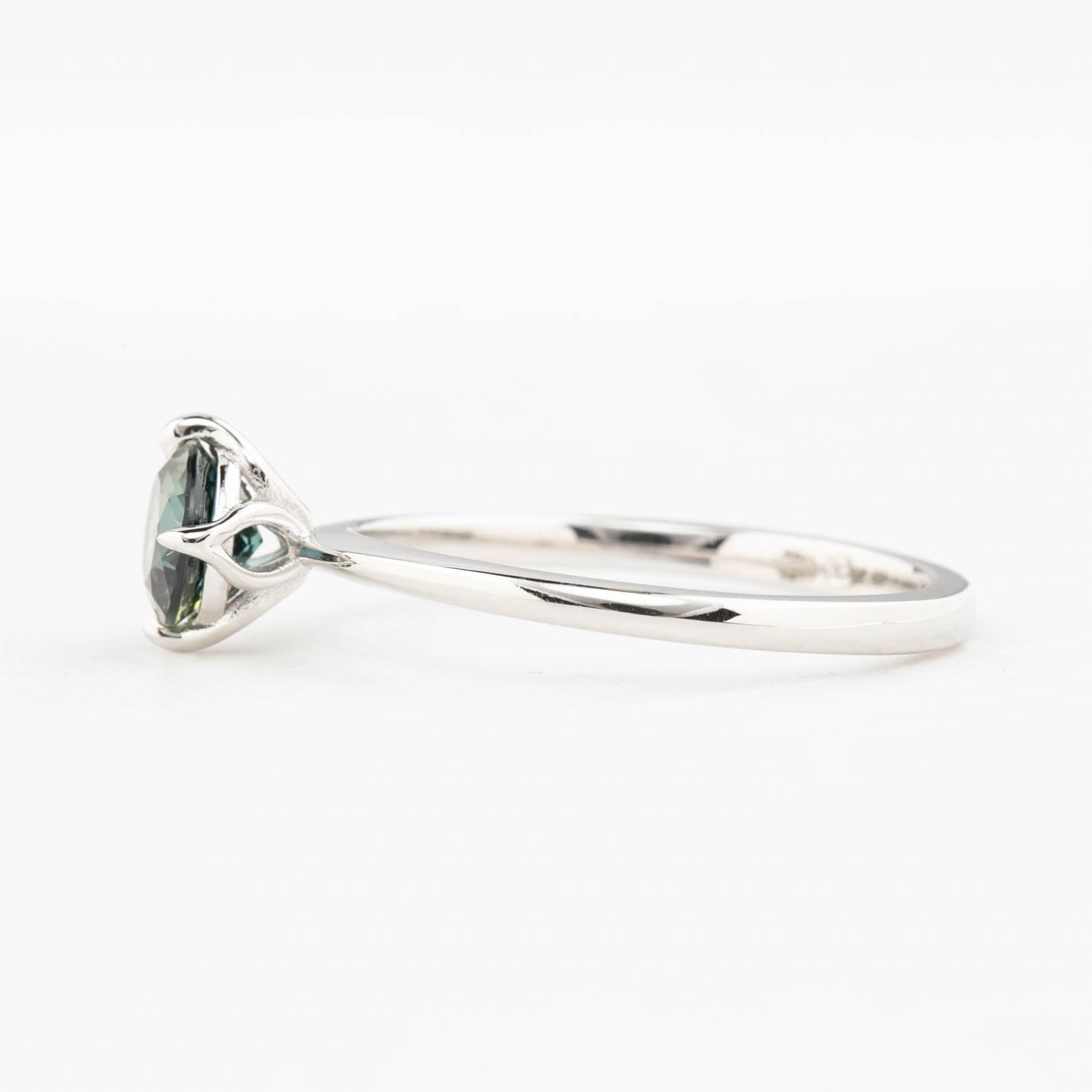 Alice Ring, 0.85ct Queensland Sapphire ring with a green gemstone on a white background