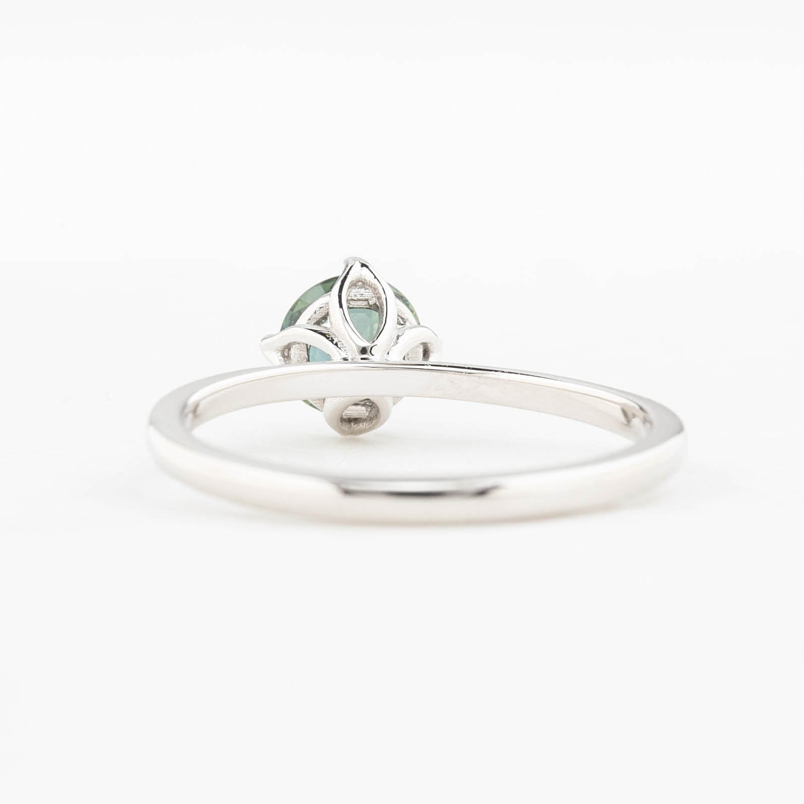 Alice Ring, 0.85ct Queensland Sapphire ring with a green gemstone on a white background