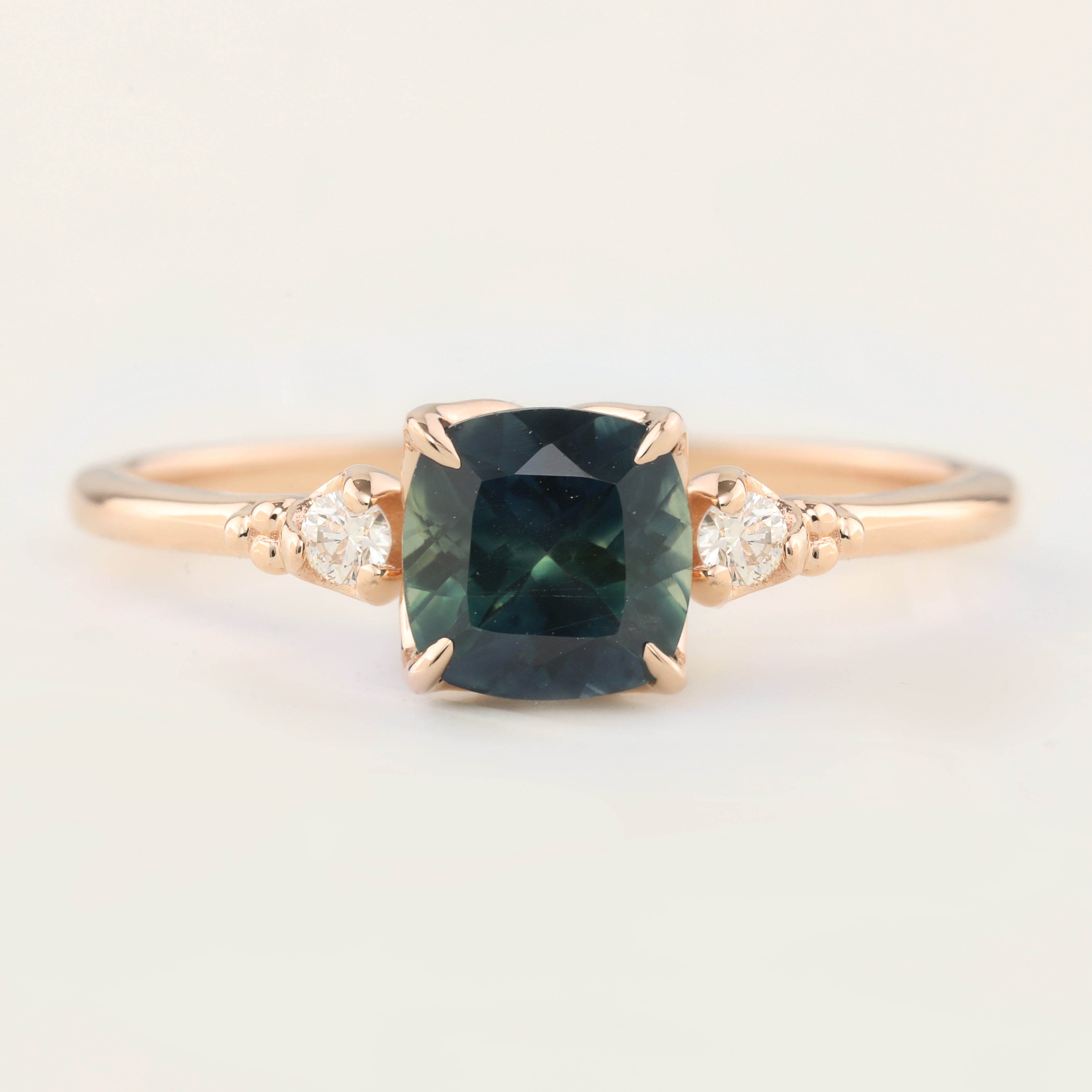 Estel Ring with 1.31ct cushion cut dark teal Montana sapphire and white diamonds in 14k rose gold, handmade and unique.