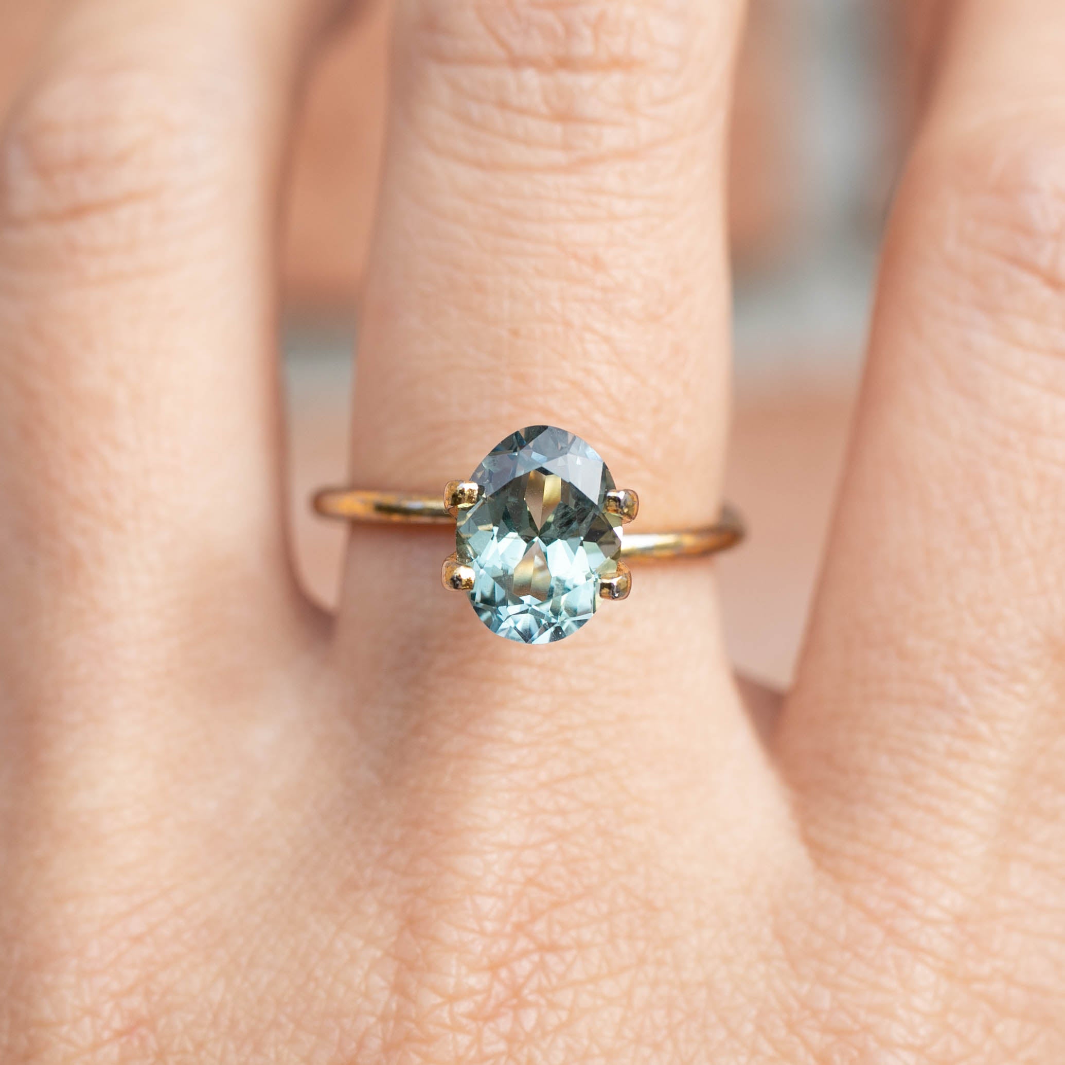 2.45ct Oval Cut Light Green Montana Sapphire ring with oval light green-blue sapphire set on a delicate gold band