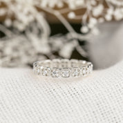 Milgrain square eternity ring with natural white diamonds set in ethically sourced solid gold band.