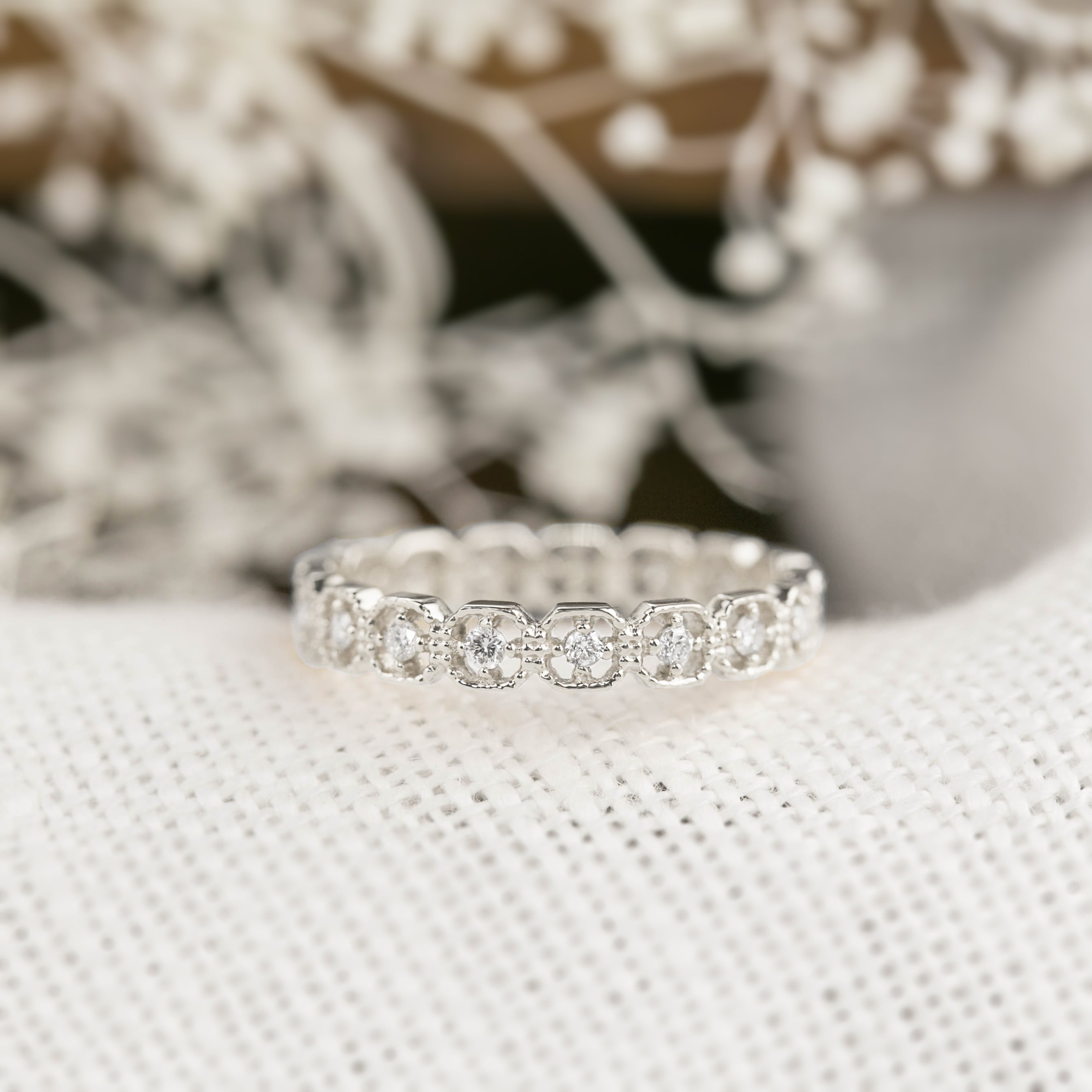 Milgrain square eternity ring with natural white diamonds set in ethically sourced solid gold band.