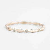 Delicate Aria Eternity Ring with natural white diamonds set in ethically sourced solid gold band.