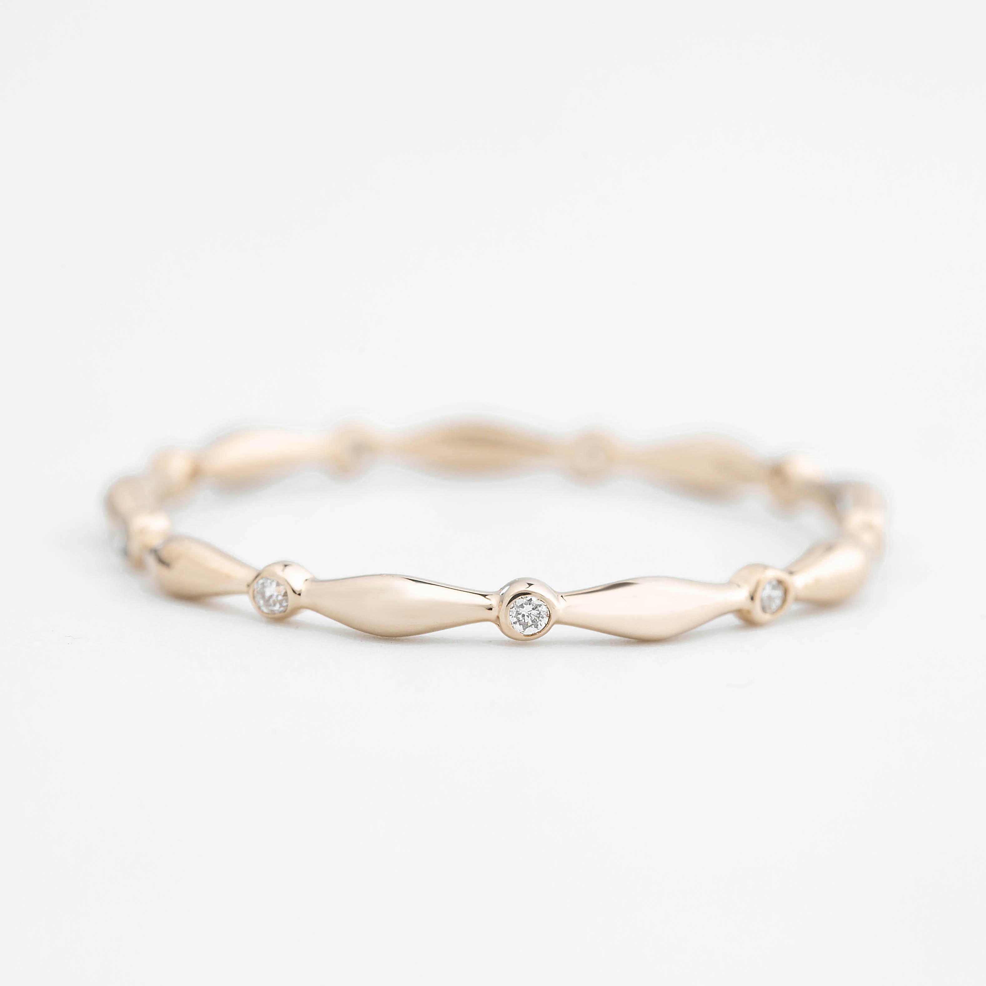 Delicate Aria Eternity Ring with natural white diamonds set in ethically sourced solid gold band.