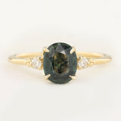Estel Ring featuring a 1.93ct green sapphire with white diamond accents in 14k recycled yellow gold, handmade and unique.