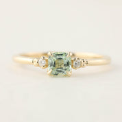 14k yellow gold ring with 0.5ct radiant cut mint tourmaline and two small brilliant cut diamonds