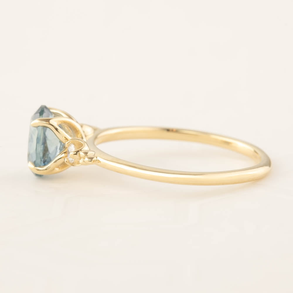 Estel Ring with 1.4ct light blue-green Montana Sapphire set in recycled 14k yellow gold, one of a kind handmade design.