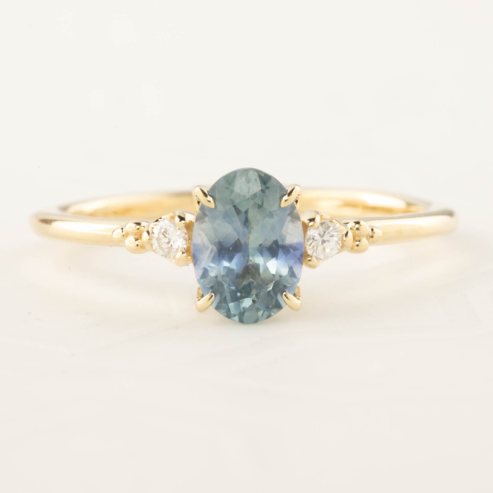 Estel Ring 1.02ct Blue Oval Montana Sapphire set in 14k yellow gold with accent diamonds, handmade and GIA certified.