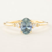 Estel Ring 1.02ct Blue Oval Montana Sapphire set in 14k yellow gold with accent diamonds, handmade and GIA certified.