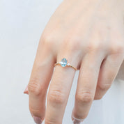 Estel Ring 1.02ct Blue Oval Montana Sapphire in 14k yellow gold with natural diamonds, one of a kind, handmade ring on finger
