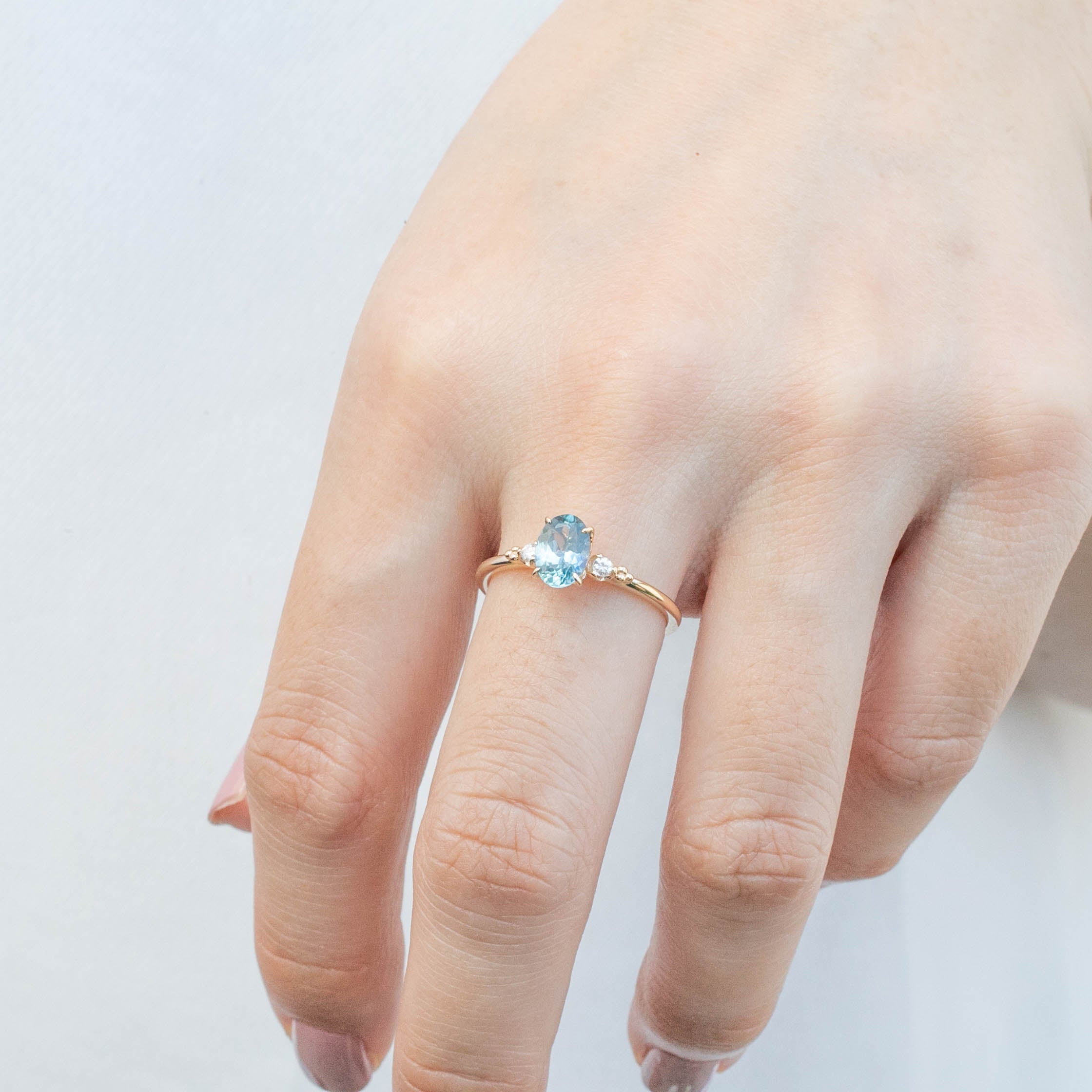 Estel Ring 1.02ct Blue Oval Montana Sapphire in 14k yellow gold with natural diamonds, one of a kind, handmade ring on finger