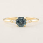 Estel Ring with 1.04ct blue green Montana Sapphire and white diamonds, handmade in recycled 14k gold band.