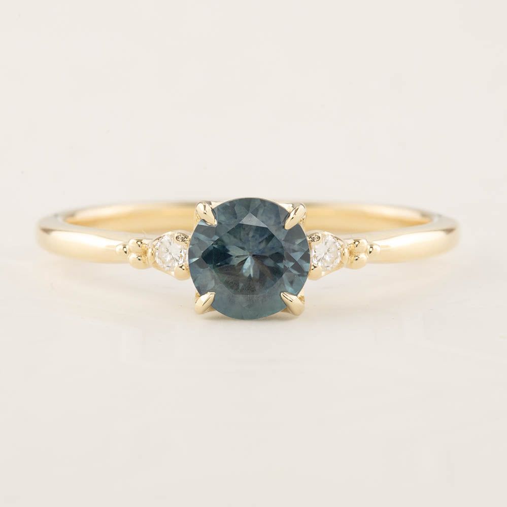 Estel Ring with 1.04ct blue green Montana Sapphire and white diamonds, handmade in recycled 14k gold band.