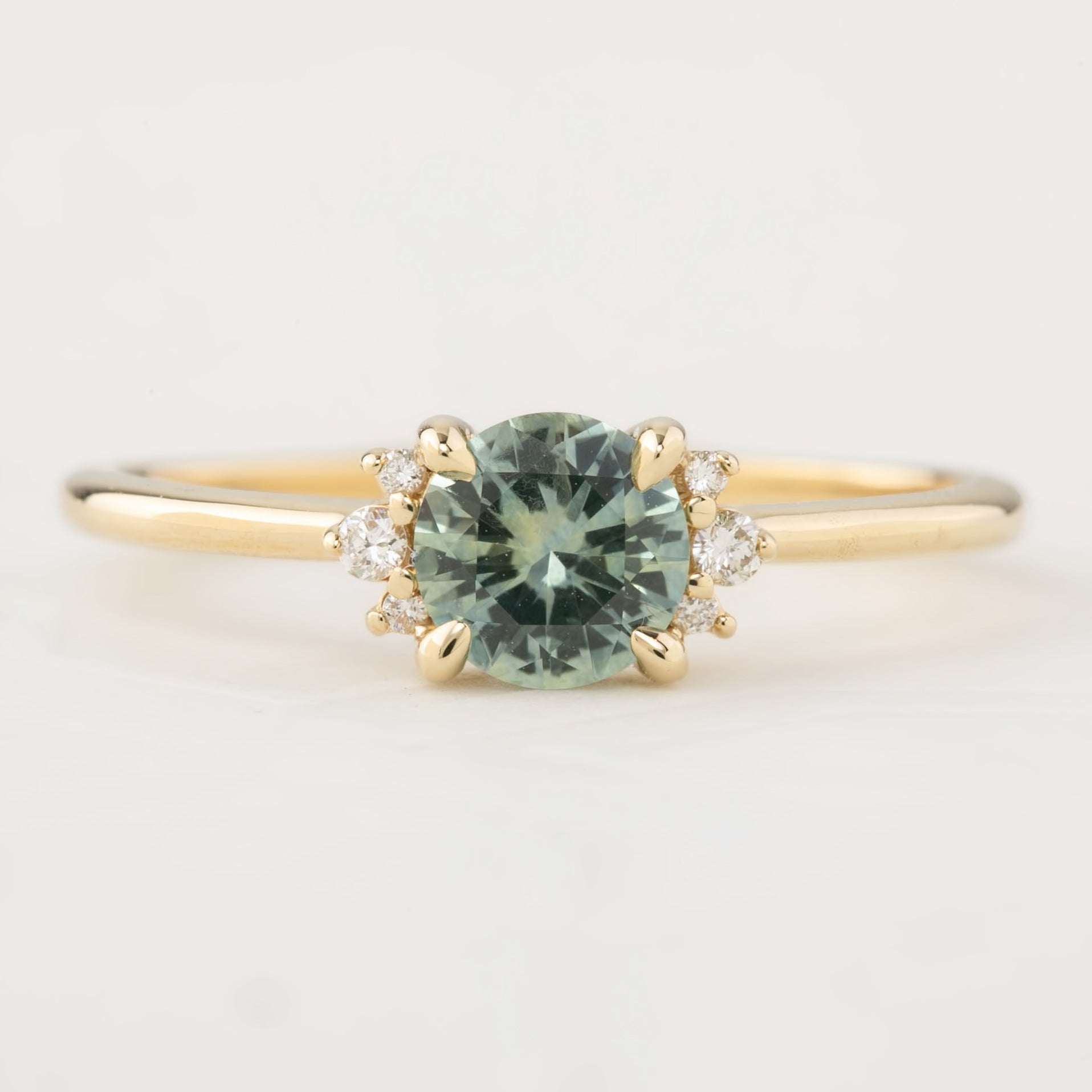 Lena Ring with 0.65ct light mint green Montana sapphire, handmade, ethically sourced, set in recycled 14k yellow gold