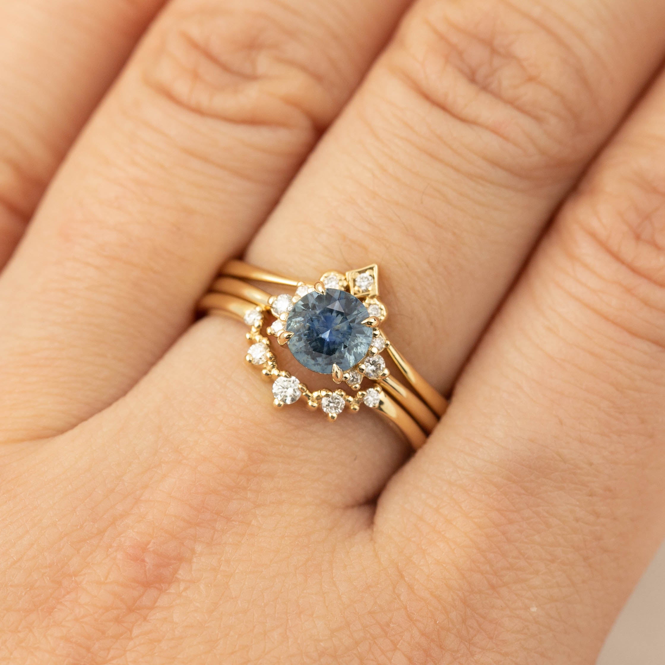 Lena Ring featuring 1ct Blue Montana Sapphire and diamond accents in recycled 14k yellow gold, handmade and one of a kind.