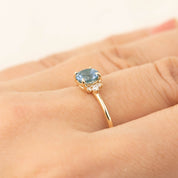 Lena Ring featuring a 1ct blue Montana sapphire and diamonds in recycled 14k yellow gold, handmade and one of a kind.