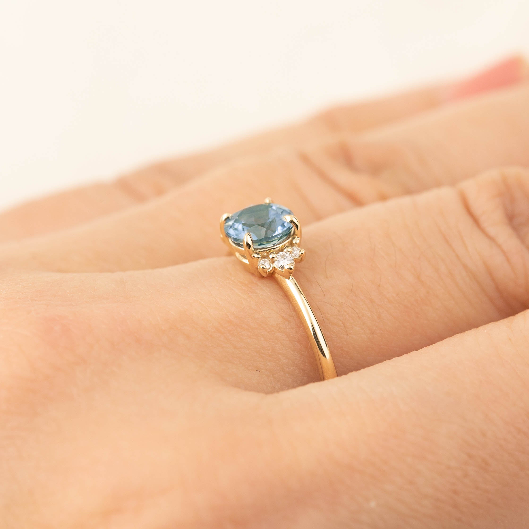 Lena Ring featuring a 1ct blue Montana sapphire and diamonds in recycled 14k yellow gold, handmade and one of a kind.