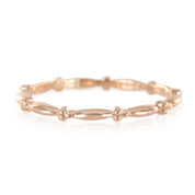 Solid gold Julia Ring with full eternity bead design, 1.7mm band, ethically sourced, displayed on white background.