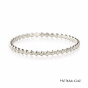 14k white gold bead eternity ring with 1.5mm band width displayed on white background