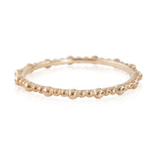 Solid gold full eternity Gemma Ring with a beaded design and 1.5mm band width, shown on white background.