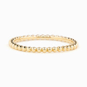 Solid gold bead eternity ring with a 1.5mm band, full eternity style, ethically sourced, shown on white background.