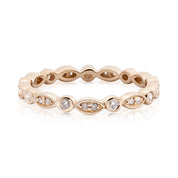 Elegant Seren Ring featuring natural white diamonds in a solid gold band with unique marquise and round settings.