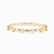 Delicate 1mm solid gold ring featuring natural white diamonds with G color SI clarity in a unique spaced design
